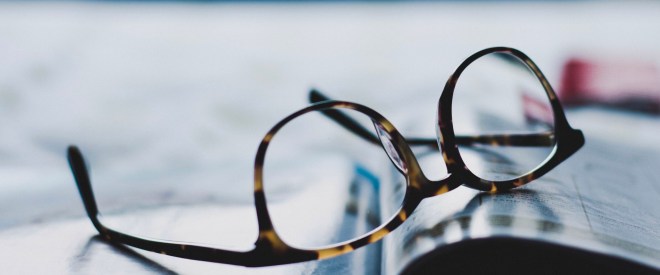 Eyeglasses over a book
